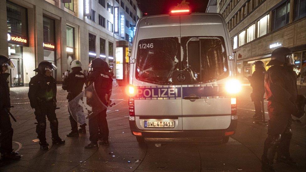 Damaged police vehicle, guarded by police in Stuttgart, 21 Jun 20