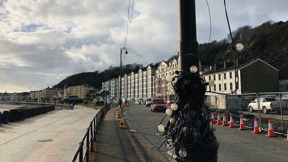 Festoon fairy lights wrapped around a lamppost