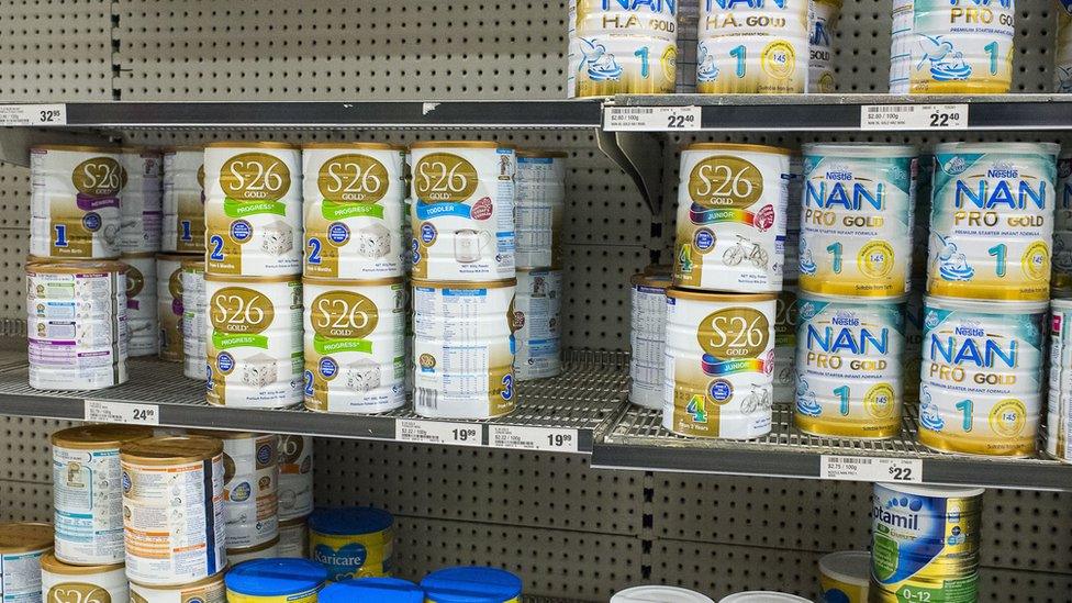 Cans of infant formula in an Australian supermarket