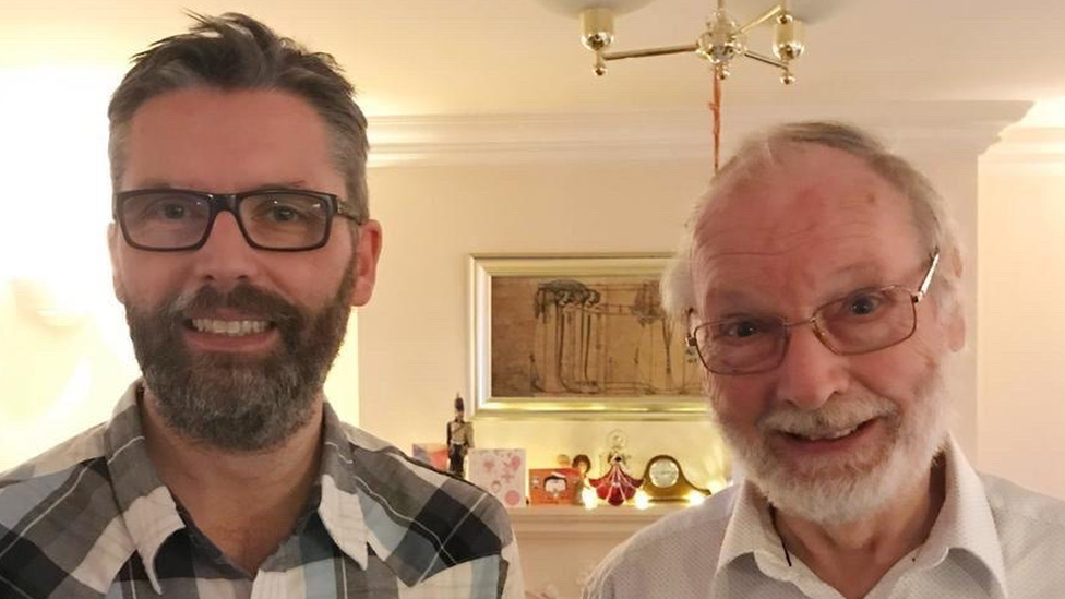 Geoff Barrett and his father stand side by side