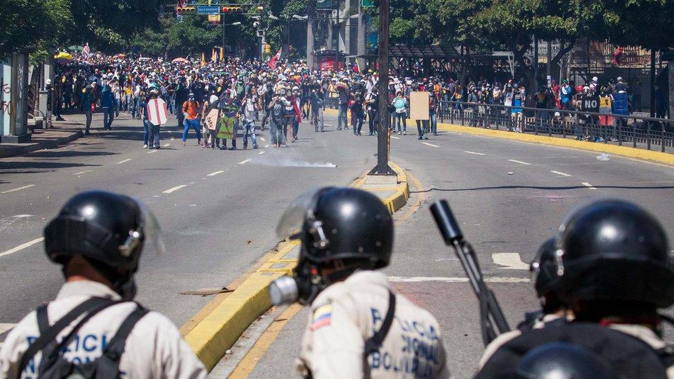 Protesters clash with police during an opposition protest in Caracas, Venezuela, 30 May 2017