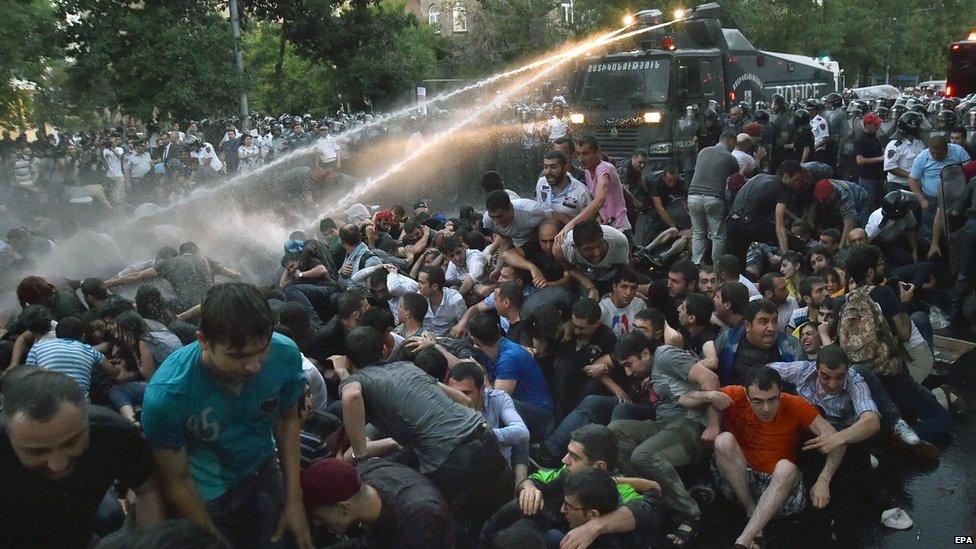 Armenian police forces use water cannons against protesters on 22 June 2015