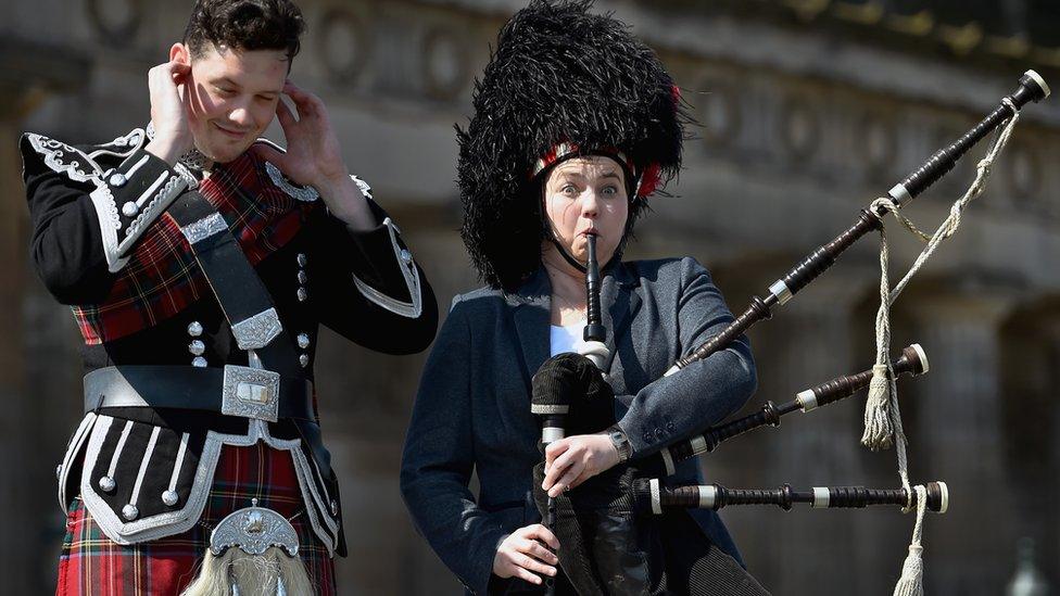 Ruth Davidson trys on piper Peter Wade's bear skin hat on April 23, 2015