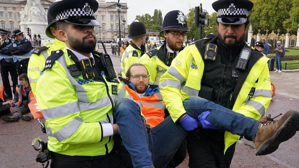 Protestors being removed by police