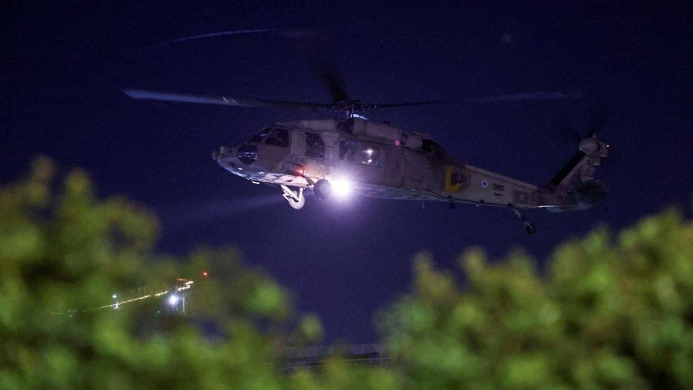 A helicopter carrying hostages released amid a hostages-prisoners swap deal between Hamas and Israel arrives at Sheba Medical Center in Ramat Gan, Tel Aviv district, Israel, November 30