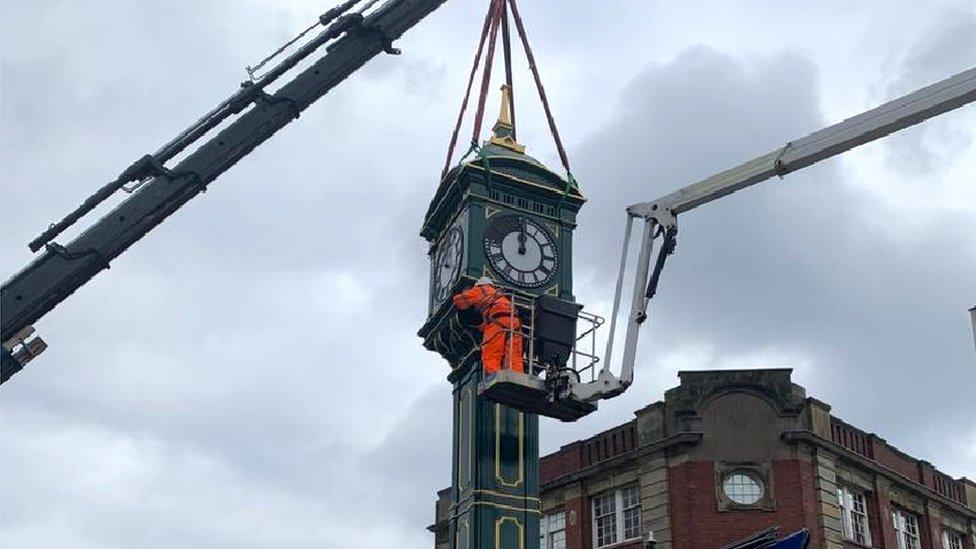 Clock being put in place