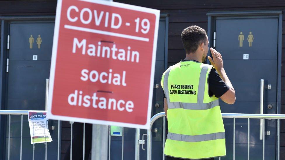 A public toilets queue marshal