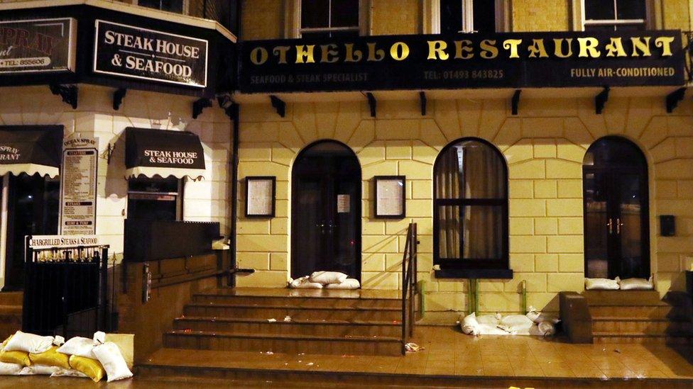 Sandbags outside restaurant