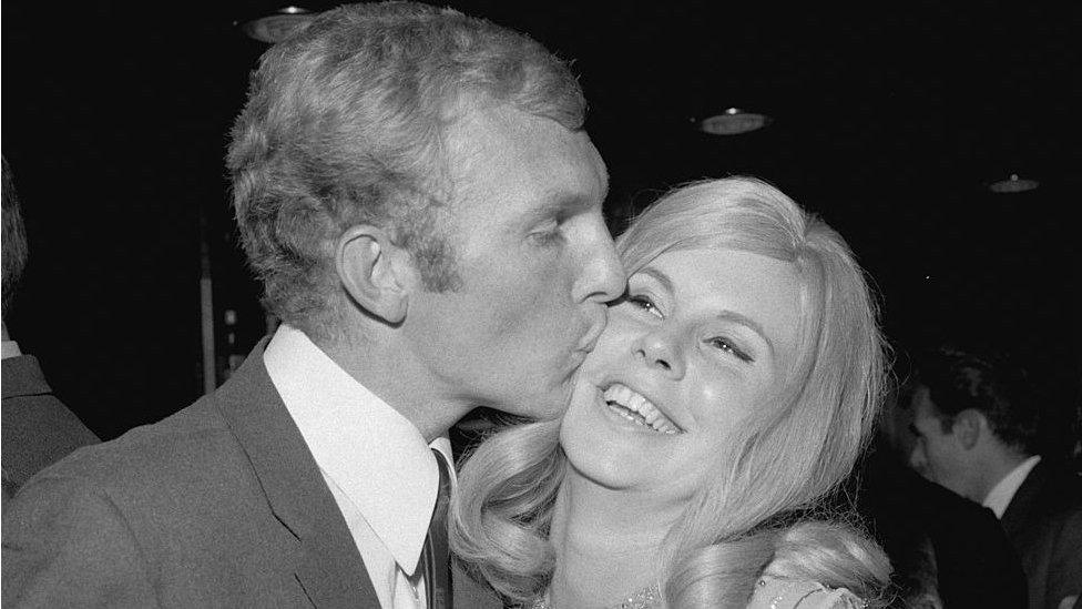 Bobby Moore kissed his wife, Tina, at a reception for the England football team after their 1966 World Cup win