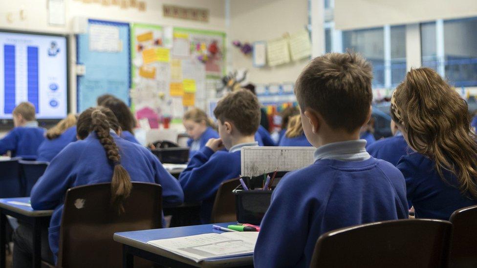 A school classroom where children are studying