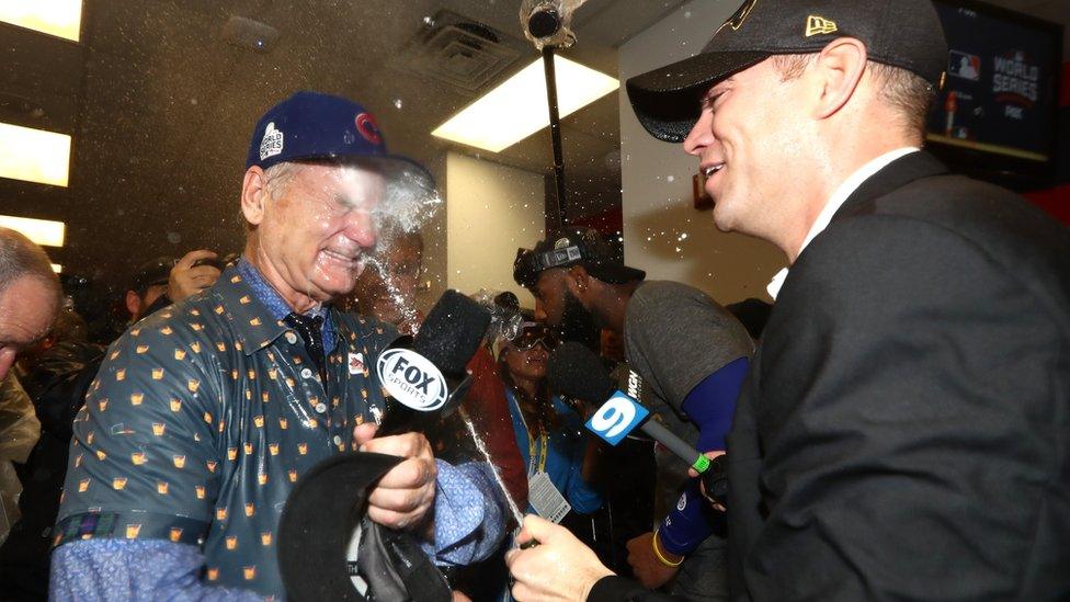 Murray sprayed with champagne by Cubs president of baseball operations theo epstein