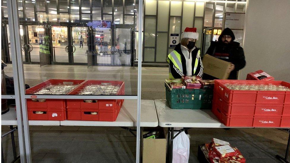 Volunteers with takeaway meals