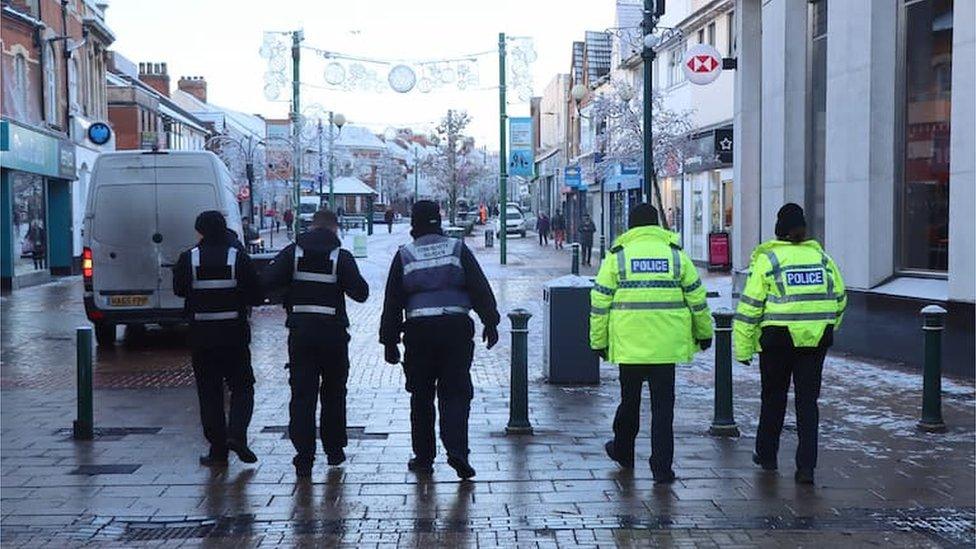 Litter enforcement officers on patrol with police