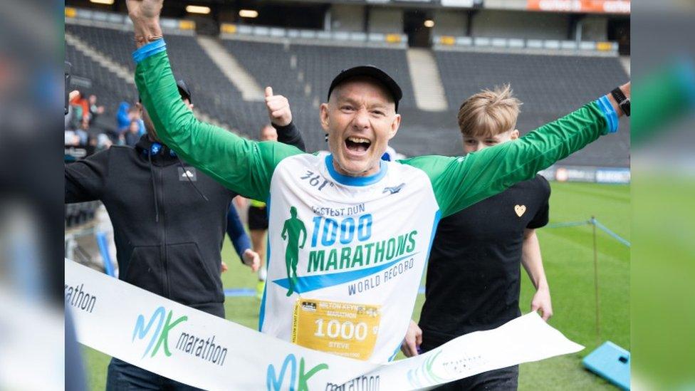 Steve Edwards crossing the finishing line