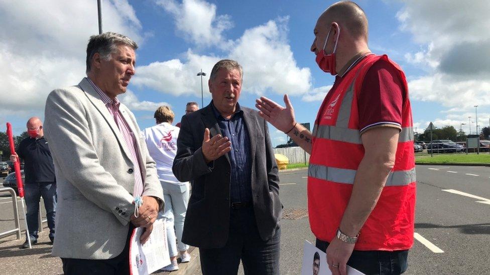 DUP MPs Paul Girvan and Sammy Wilson in discussion with Unite's George Brash