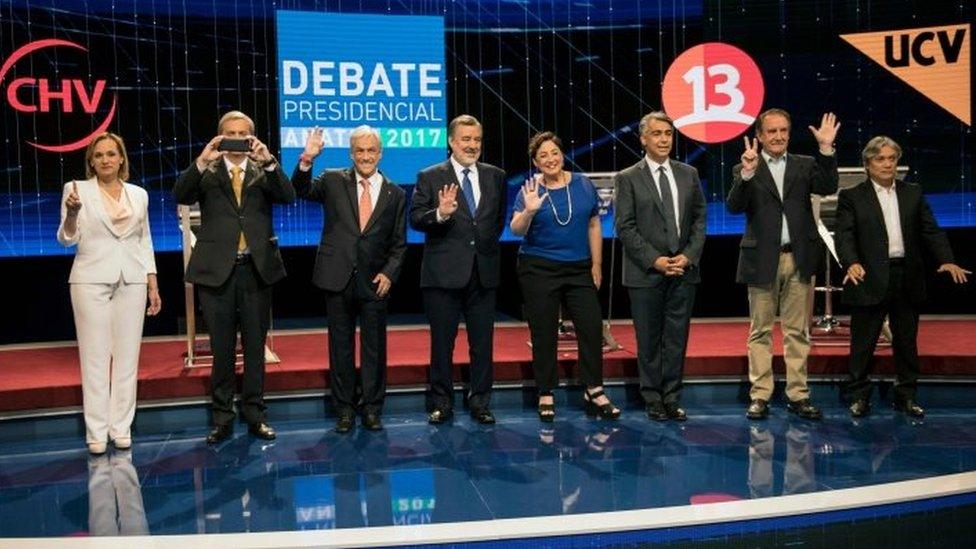 Presidential candidates Carolina Goic from Christian Democracy, Jose Antonio Kast, from the Independent Party, Sebastian Pinera from Chile Vamos, Alejandro Guiller from the ruling party, Beatriz Sanchez from Frente Amplio party , Marco Enriquez-Ominami from Progresista Party, Eduardo Artes from Union Patriotica party and Alejandro Navarro from MAS party, are pictured before the presidential debate in Santiago, on November 6, 2017.