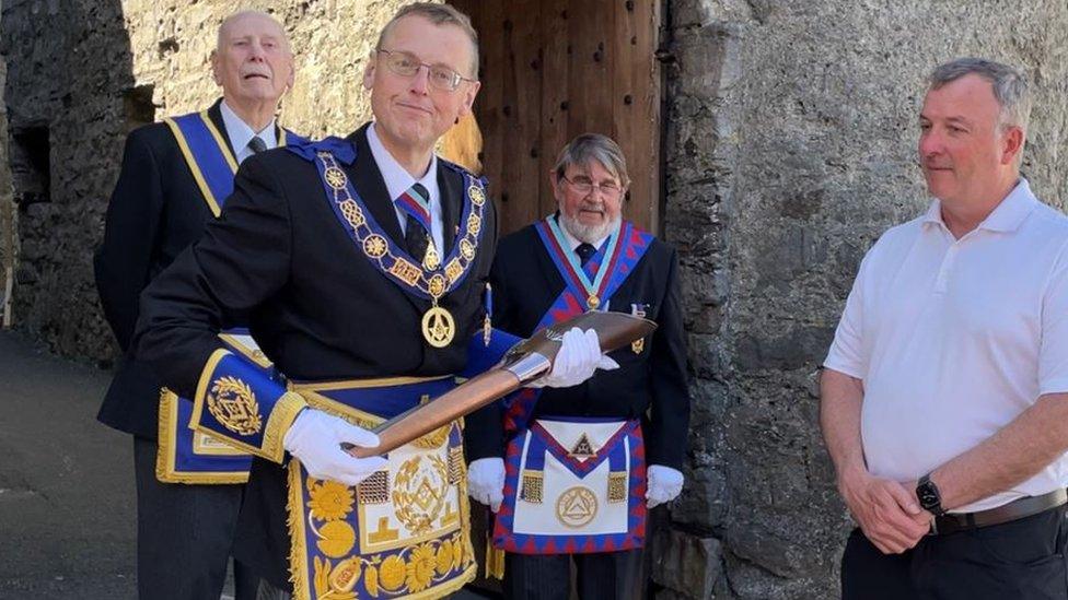 Freemasons Martin Blackburn holding the baton at Castle Rushen