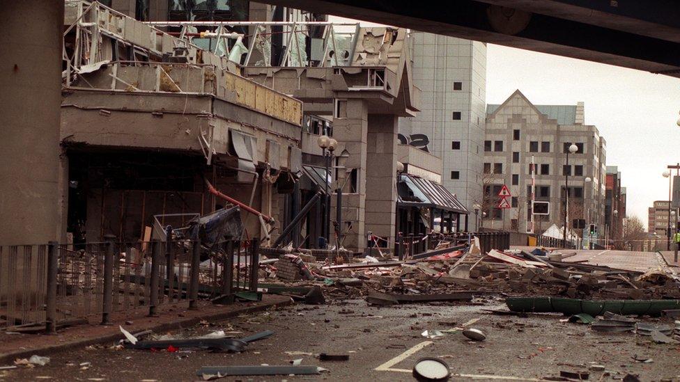 Debris strewn across the scene of the IRA bomb blast in London's Docklands