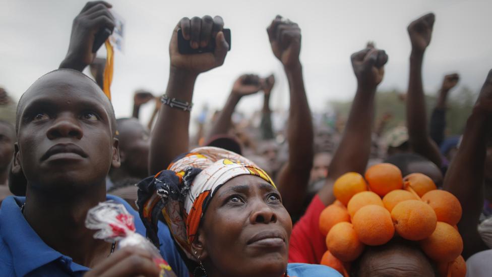 Supporters of Raila Odinga, the leader of the opposition coalition the National Super Alliance (NASA) and its presidential candidate, cheer as they listen to their leader"s speech during a rally in Nairobi, Kenya, 18 October 2017.