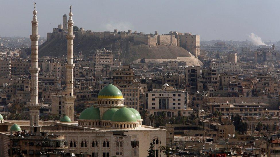 A general view shows rising smoke after strikes near Aleppo citadel in Aleppo city, Syria December 3, 2016.