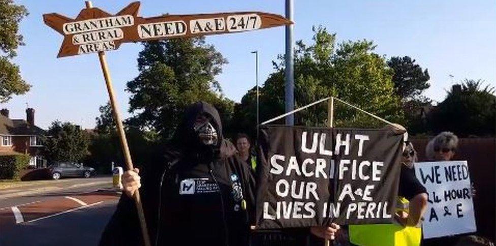 Protestor dressed as grim reaper outside Grantham A&E