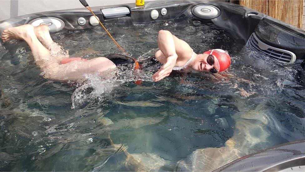 Wendy Oliver swimming in her hot tub