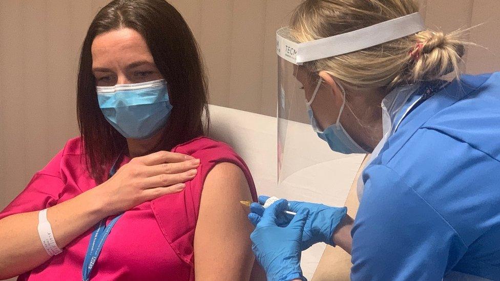 Undated handout photo issued by Manchester University NHS Foundation Trust (MFT) of Dr Claire Cole, head of research delivery at MFT, receiving a dose of the vaccine developed by the Janssen pharmaceutical companies of Johnson & Johnson after she became the first volunteer for the phase three trial