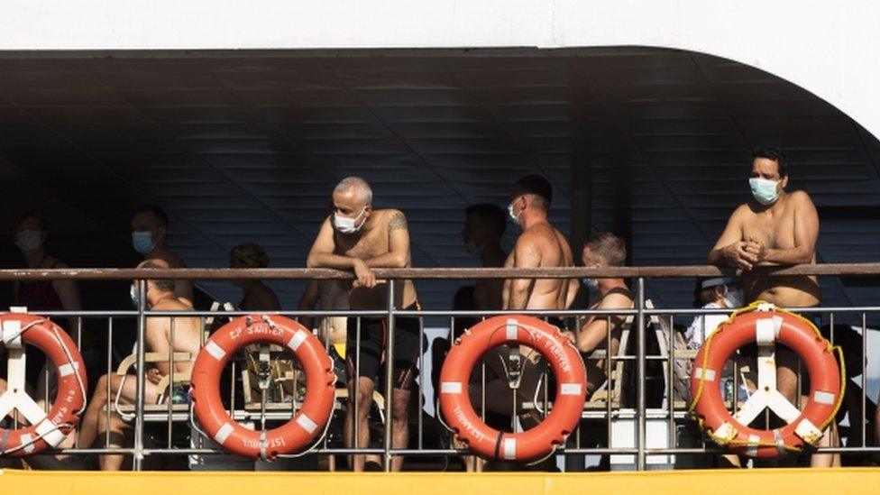 Competitors wear masks before the race begins