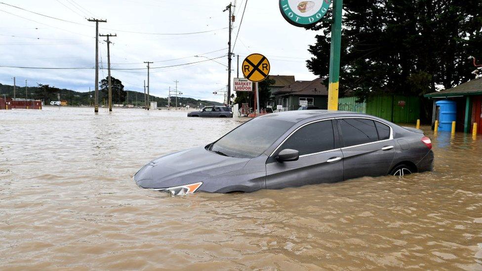 A car submerged in floodwater