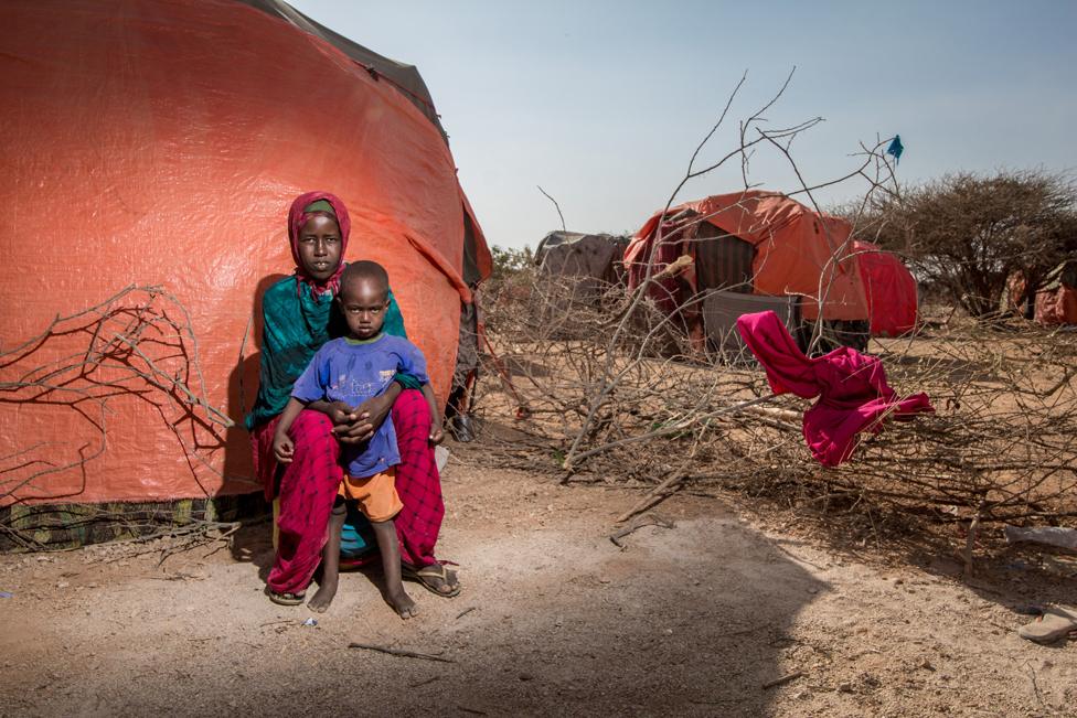 Fadumo, a mother of three children, with her one year old son Kulmiye