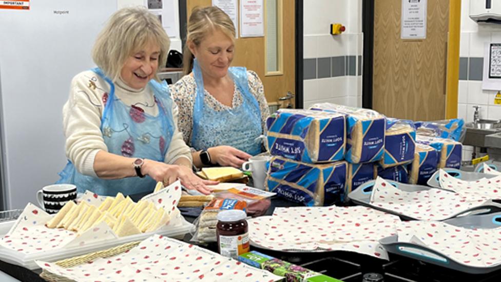 Volunteers making sandwiches