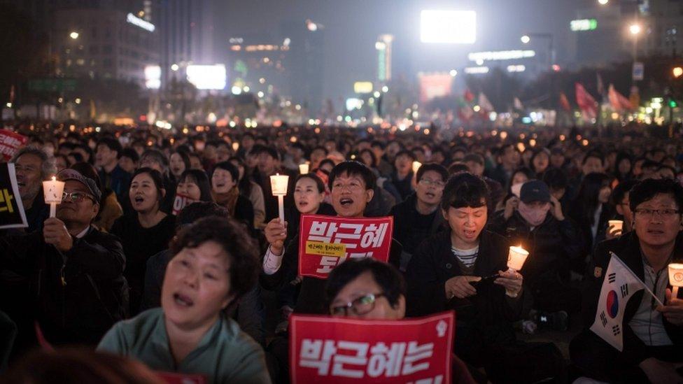 Protesters chanted, sang and held banners