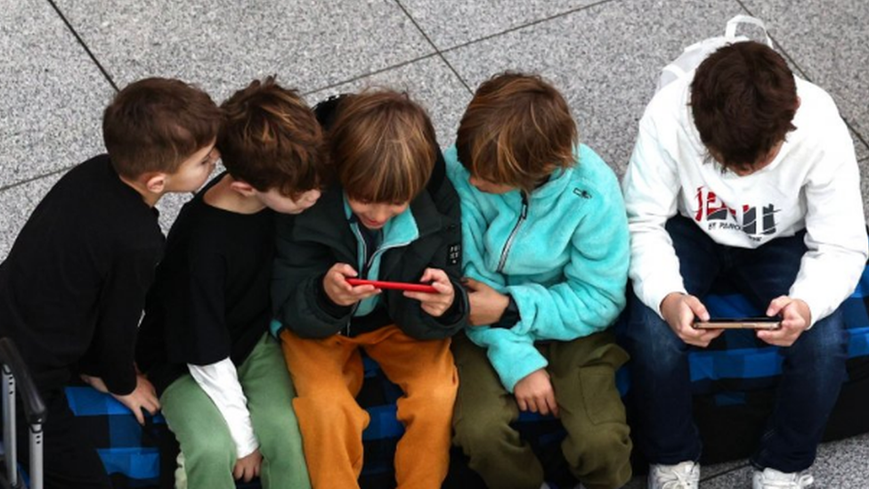 Children using smartphones