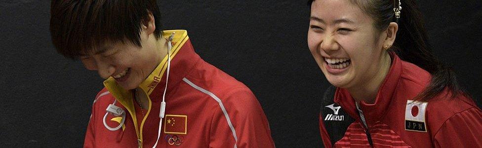 Olympic table tennis players Ai Fukuhara (R) of Japan and Ning Ding of China share a laugh following a press conference at Riocentro complex in Rio de Janeiro