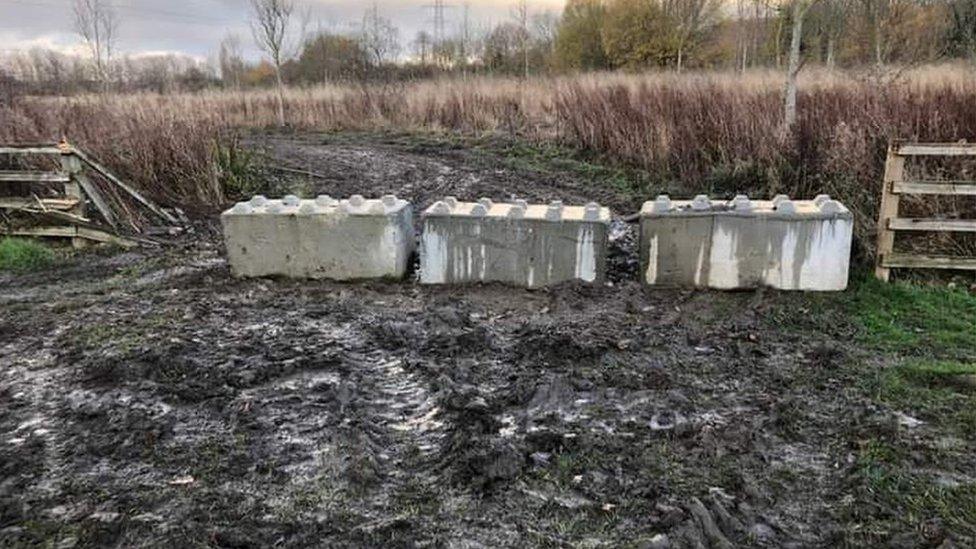 Tyre marks in ground previously blocked by concrete bollards