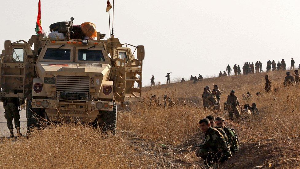 Iraqi Kurdish Peshmerga fighters hold a position in Sheikh Ali village near the town of Bashiqa, some 25km from Mosul, 20 October 2016