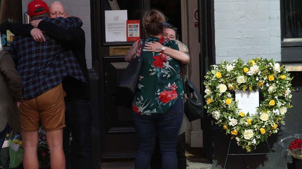 Flowers and tributes were laid outside the Blagrave Arms, which is near Forbury Gardens