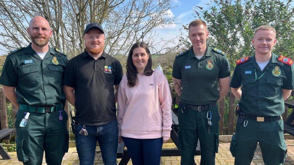 Ashleigh Loach with her husband Dave and three paramedics