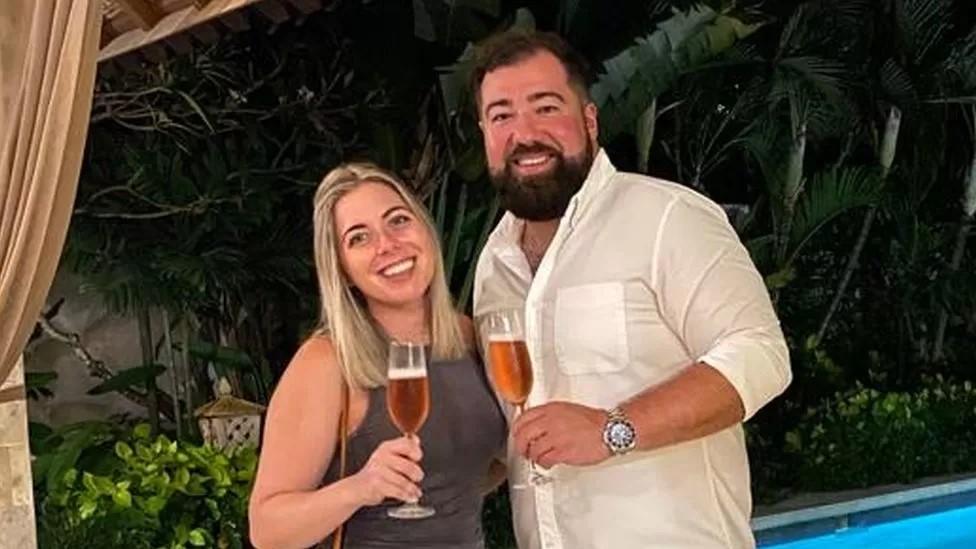 Adam Ashall-Kelly and Christine Marriott toasting their upcoming wedding