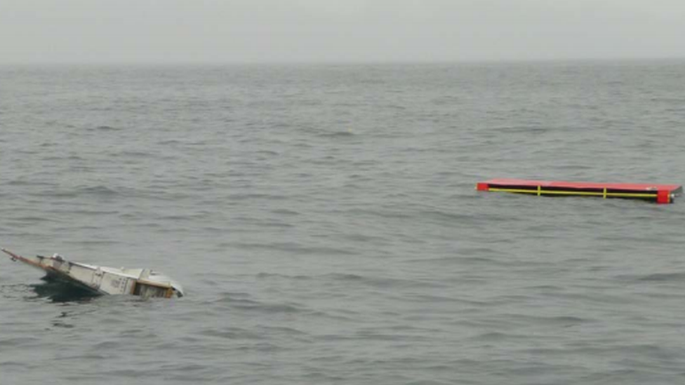 The genuine and replica flaperons at sea in calm weather, having just been deployed