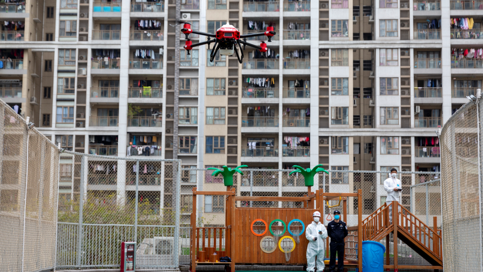 flying a drone over a kids park