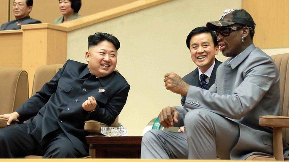 North Korean leader Kim Jong-un (C), his wife Ri Sol-Ju (L) and former US basketball star Dennis Rodman (R) watching a basketball game