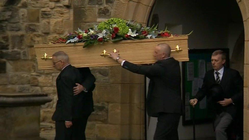 Mike Neville's coffin being brought out of the church