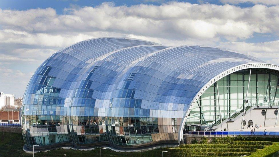 The Glasshouse International Centre for Music, which is a large domed building with a silver exterior on the banks of the Tyne.