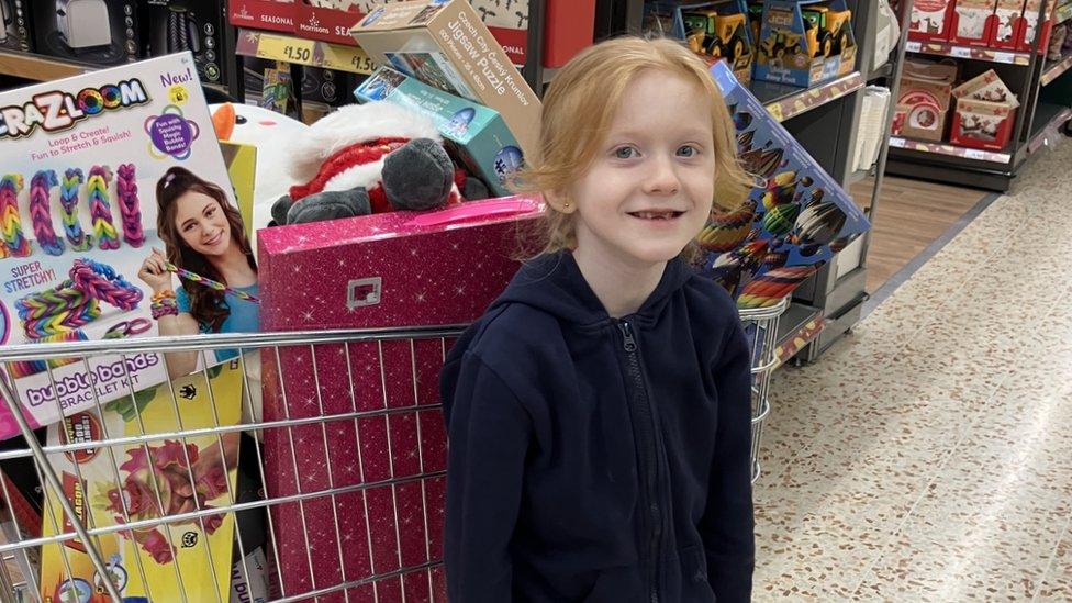 Lara-May with the toys she bought for children living in poverty