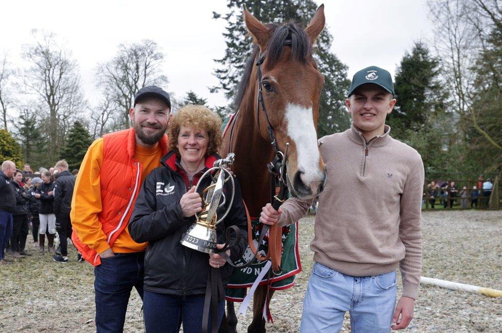 Corach Rambler with trainer Lucinda Russell and owners Cameron Sword (right) and Thomas Kendall