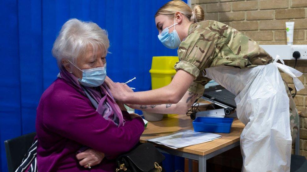 Woman being vaccinated