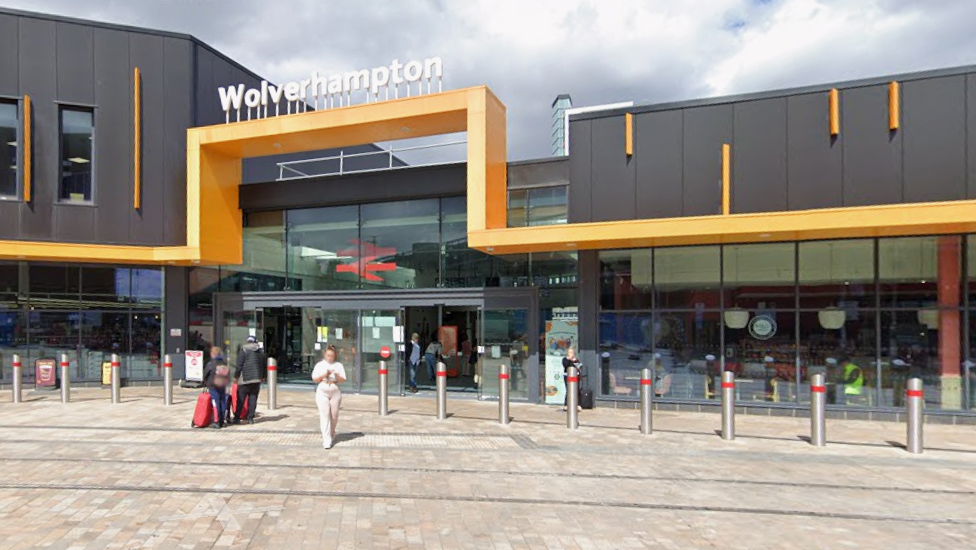 A large modern building with Wolverhampton in large letters across the top of the entrance