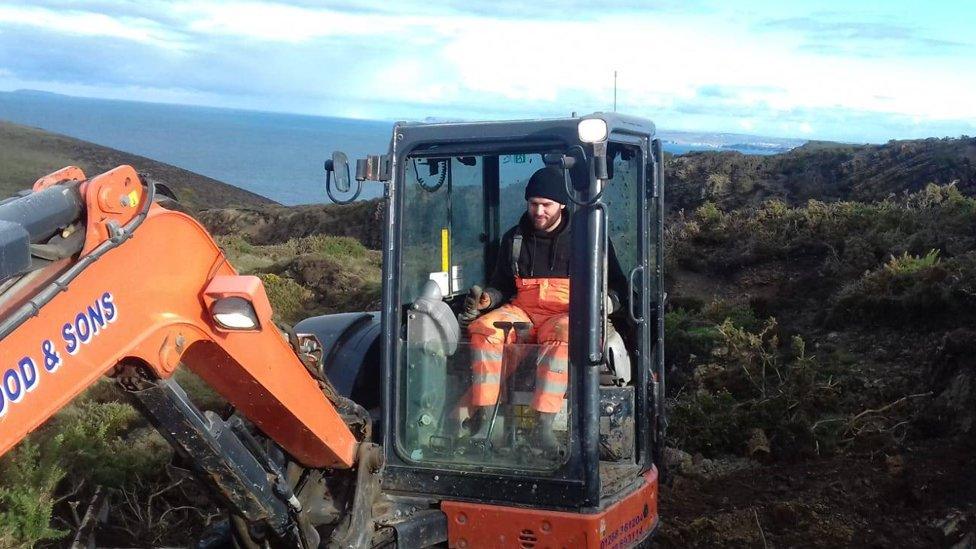 Jake Crocker in a digger