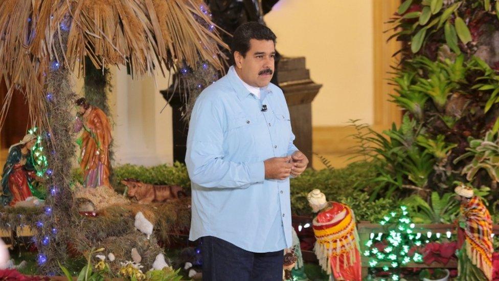 Venezuela's President Nicolas Maduro speaks in front of a nativity scene during his weekly broadcast "en contacto con Maduro" (In contact with Maduro) at the Miraflores Palace in Caracas, in this December 29,